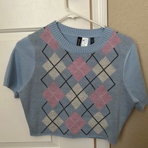 This a a blue shirt with pink, white, and black. I bought it from H &M.